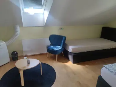 Ein Bett oder Betten in einem Zimmer der Unterkunft Gästehaus Windheim (Karlsruhe-Knielingen 2)