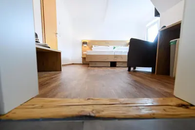 Ein Bett oder Betten in einem Zimmer der Unterkunft Zum Scheffelhof