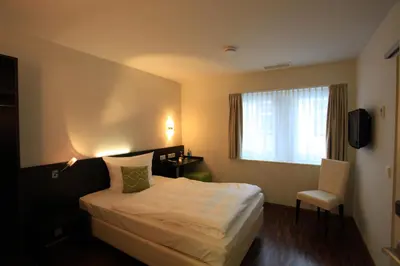 Ein Bett oder Betten in einem Zimmer der Unterkunft Art Hotel Lauterbach
