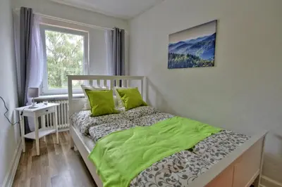 Ein Bett oder Betten in einem Zimmer der Unterkunft Ferienwohnung Eulenhof