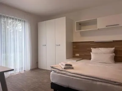 Ein Bett oder Betten in einem Zimmer der Unterkunft New Age Boardinghaus P5