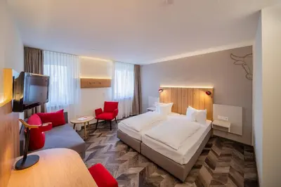 Ein Bett oder Betten in einem Zimmer der Unterkunft Hotel Zum Goldenen Ochsen am Schlossgarten