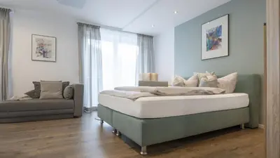 Ein Bett oder Betten in einem Zimmer der Unterkunft Erfblick-Apartments
