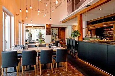 Ein Restaurant oder anderes Speiselokal in der Unterkunft Hotel Restaurant Fronmühle 3 Sterne Superior
