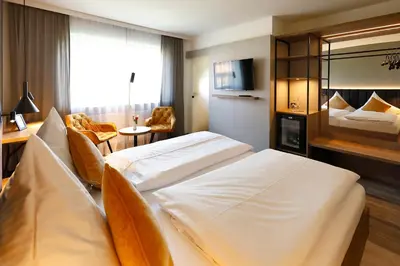 Ein Bett oder Betten in einem Zimmer der Unterkunft Hotel Restaurant Fronmühle 3 Sterne Superior
