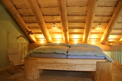 Ein Bett oder Betten in einem Zimmer der Unterkunft Holzhauszeit