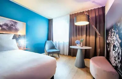 Ein Bett oder Betten in einem Zimmer der Unterkunft NYX Hotel Mannheim by Leonardo Hotels