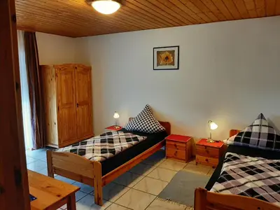 Ein Bett oder Betten in einem Zimmer der Unterkunft Gästehaus Rüger