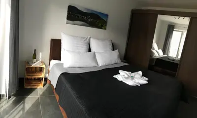 Ein Bett oder Betten in einem Zimmer der Unterkunft Main Boarding House