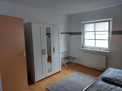 Ein Bett oder Betten in einem Zimmer der Unterkunft Ferienwohnung Frühlingstraße