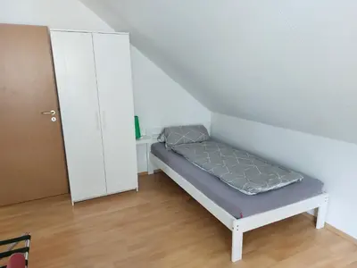 Ein Bett oder Betten in einem Zimmer der Unterkunft Ferienwohnung Frühlingstraße