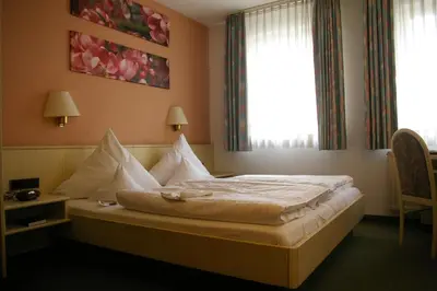 Ein Bett oder Betten in einem Zimmer der Unterkunft Zum treuen Bartel