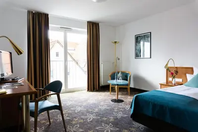 Ein Bett oder Betten in einem Zimmer der Unterkunft Hotel Württemberger Hof