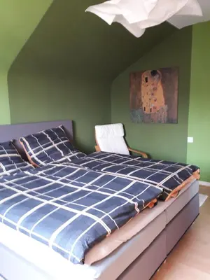 Ein Bett oder Betten in einem Zimmer der Unterkunft Ferienwohnung im Rhein-Main Gebiet nahe Frankfurt, Rödermark