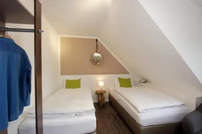 Ein Bett oder Betten in einem Zimmer der Unterkunft Hotel Restaurant Reichsadler