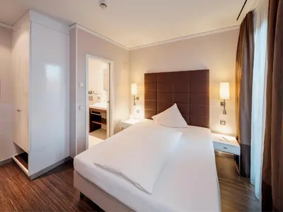 Ein Bett oder Betten in einem Zimmer der Unterkunft Hotel Eberhards am Wasser