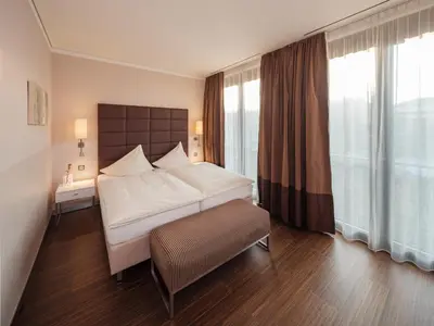 Ein Bett oder Betten in einem Zimmer der Unterkunft Hotel Eberhards am Wasser