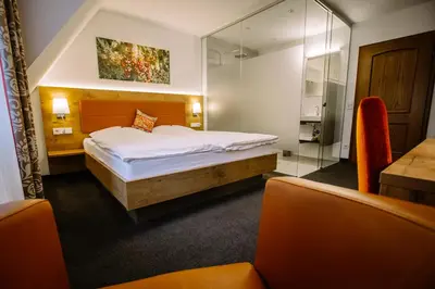 Ein Bett oder Betten in einem Zimmer der Unterkunft Hotel Restaurant Lamm Rosswag