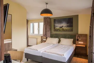 Ein Bett oder Betten in einem Zimmer der Unterkunft Restaurant Grüner Baum
