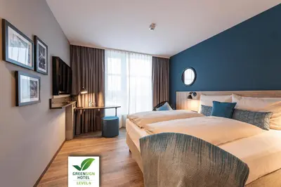 Ein Bett oder Betten in einem Zimmer der Unterkunft HARBR Hotel Heilbronn, a member of Radisson Individuals