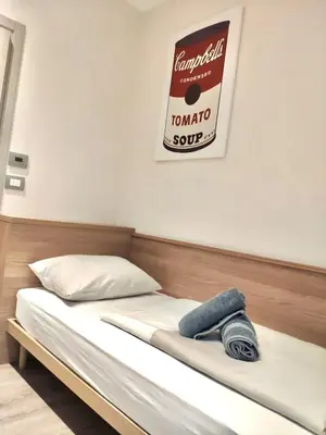 Ein Bett oder Betten in einem Zimmer der Unterkunft Kriemhilde Dependance