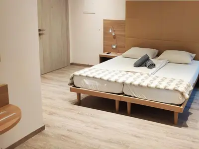 Ein Bett oder Betten in einem Zimmer der Unterkunft Kriemhilde Dependance
