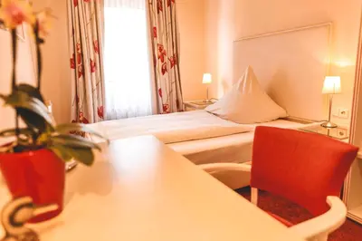 Ein Bett oder Betten in einem Zimmer der Unterkunft Hotel Löwen