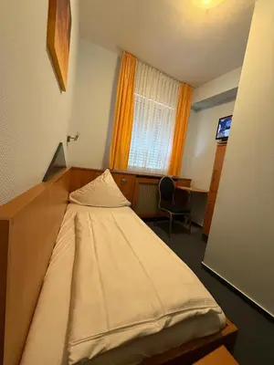 Ein Bett oder Betten in einem Zimmer der Unterkunft SVG Hotel Diversi