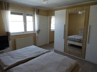 Ein Bett oder Betten in einem Zimmer der Unterkunft Ferienhaus Fam. Bisgen