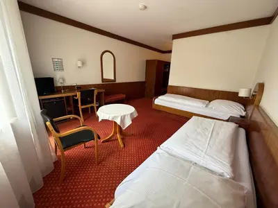 Ein Bett oder Betten in einem Zimmer der Unterkunft Hotel Post Viernheim