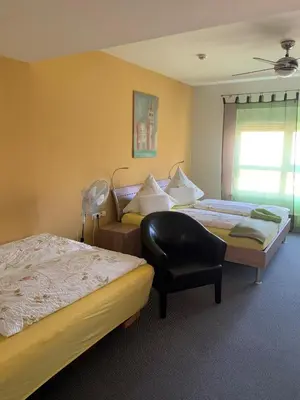 Ein Bett oder Betten in einem Zimmer der Unterkunft Park-Hotel Leimen