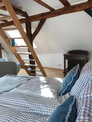 Ein Bett oder Betten in einem Zimmer der Unterkunft Fuxbau