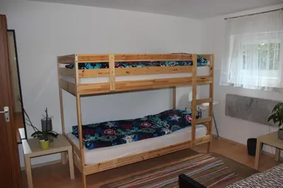 Ein Bett oder Betten in einem Zimmer der Unterkunft TOP gelegenes Appartment tla mit Garten für bis zu 5 Personen