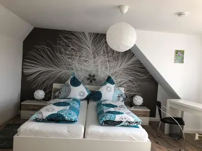 Ein Bett oder Betten in einem Zimmer der Unterkunft Ferienwohnungen Zerbe