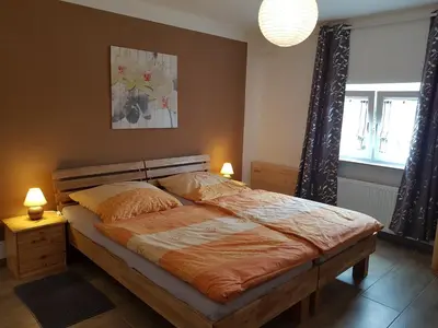 Ein Bett oder Betten in einem Zimmer der Unterkunft Ferienwohnung Kraft