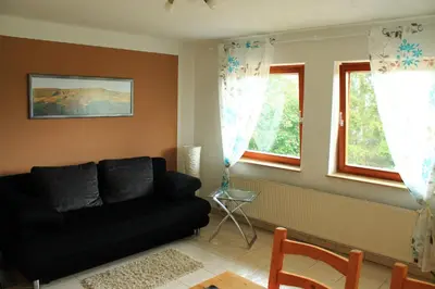 Ein Sitzbereich in der Unterkunft Ferienwohnung Kraft