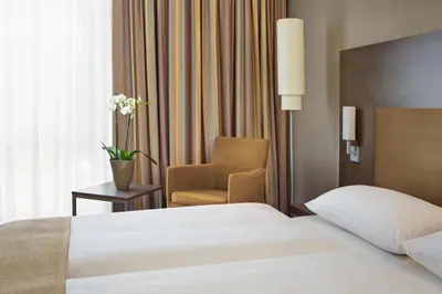 Ein Bett oder Betten in einem Zimmer der Unterkunft IntercityHotel Darmstadt