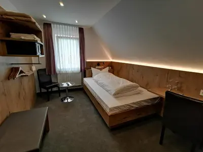 Ein Bett oder Betten in einem Zimmer der Unterkunft Gästehaus Dorflinde