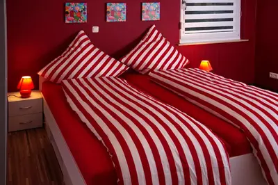 Ein Bett oder Betten in einem Zimmer der Unterkunft URS Ferienwohnung Wertheim