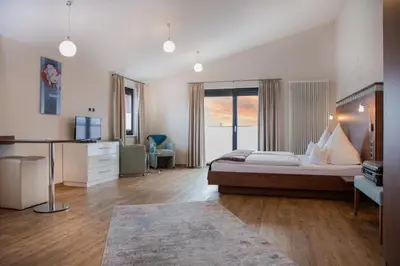 Ein Bett oder Betten in einem Zimmer der Unterkunft APARTmenthouse Rülzheim