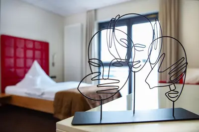 Ein Bett oder Betten in einem Zimmer der Unterkunft APARTmenthouse Rülzheim