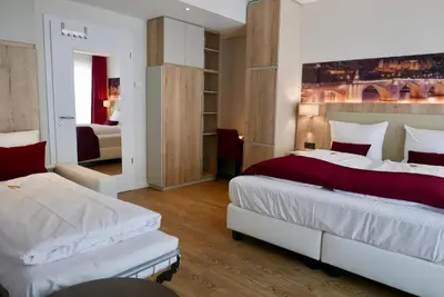 Ein Bett oder Betten in einem Zimmer der Unterkunft Rafaela Hotel Heidelberg
