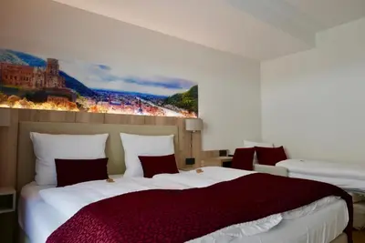 Ein Bett oder Betten in einem Zimmer der Unterkunft Rafaela Hotel Heidelberg