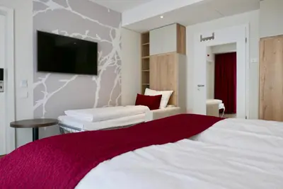 Ein Bett oder Betten in einem Zimmer der Unterkunft Rafaela Hotel Heidelberg