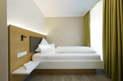 Ein Bett oder Betten in einem Zimmer der Unterkunft Hotel Hiller in Abstatt
