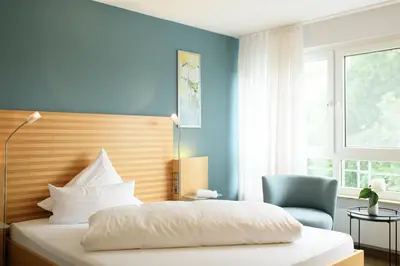 Ein Bett oder Betten in einem Zimmer der Unterkunft Hotel Hiller in Abstatt