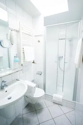 Ein Badezimmer in der Unterkunft Hotel Sauer Garni