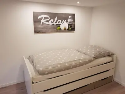 Ein Bett oder Betten in einem Zimmer der Unterkunft Dreieich-Buchschlag, Breitseeweg