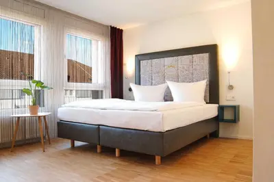 Ein Bett oder Betten in einem Zimmer der Unterkunft SEEGER Living Premium Downtown