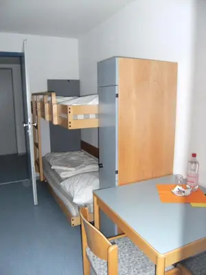 Ein Bett oder Betten in einem Zimmer der Unterkunft Jugendherberge Karlsruhe